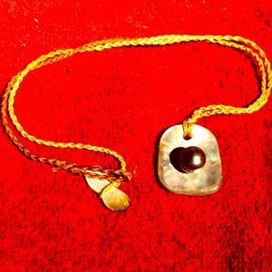 This is a lovely shell and Tahitian Pearl necklace